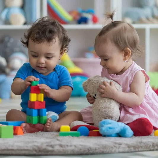 Child playing with toys supporting development and learning